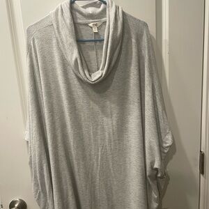 Poncho type top with cowl neck.
